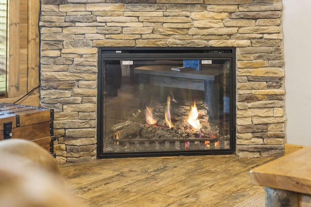 26 Cave Ln Unit 10, Indian Point, MO 65616 - detailed view of a stone fireplace and wood finished floors