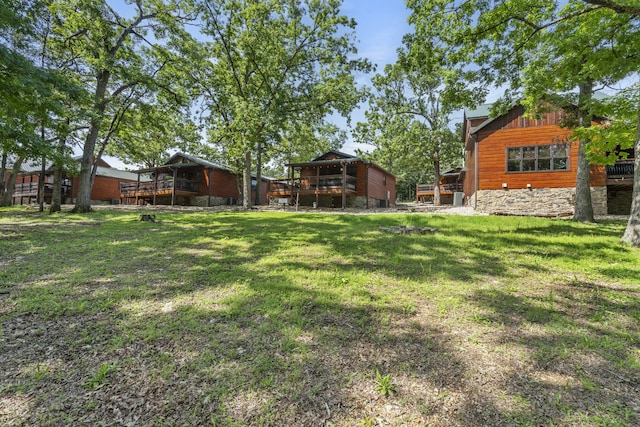 26 Cave Ln Unit 10, Indian Point, MO 65616 - view of green lawn with a deck