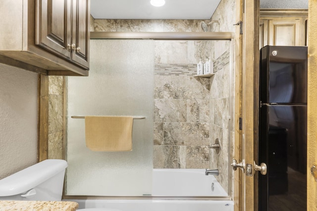 26 Cave Ln Unit 10, Indian Point, MO 65616 - bathroom with toilet and shower / bath combination with glass door