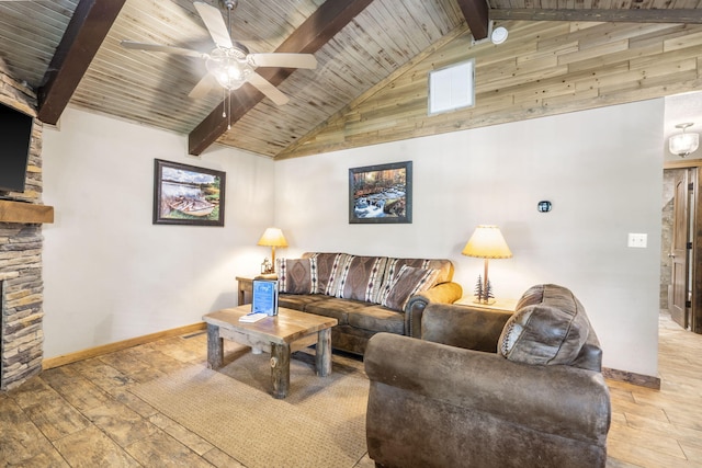 26 Cave Ln Unit 10, Indian Point, MO 65616 - living room featuring a ceiling fan, wood ceiling with exposed beams, baseboards, wood finished floors, and a fireplace