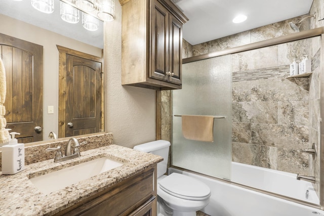 26 Cave Ln Unit 10, Indian Point, MO 65616 - bathroom with toilet, vanity, and combined bath / shower with glass door