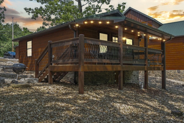 26 Cave Ln Unit 10, Indian Point, MO 65616 - back of property with a wooden deck, metal roof, and stairs