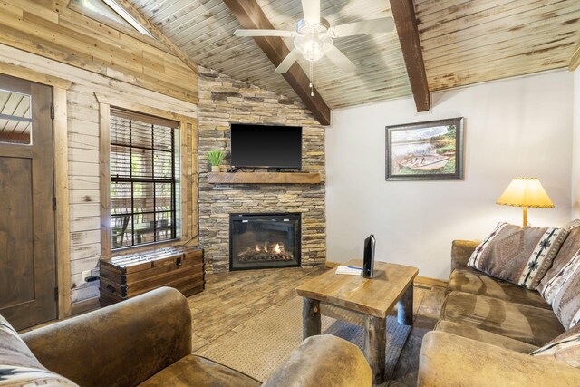 26 Cave Ln Unit 10, Indian Point, MO 65616 - living area with a fireplace, wooden ceiling with exposed beams, a ceiling fan, wood finished floors, and wooden walls