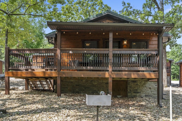26 Cave Ln Unit 10, Indian Point, MO 65616 - rear view of property featuring a deck and stone siding