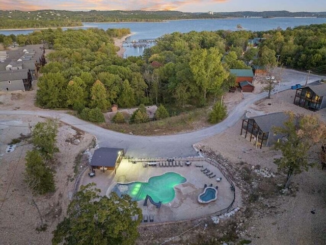 26 Cave Ln Unit 10, Indian Point, MO 65616 - aerial view at dusk of a water view and view of pool area