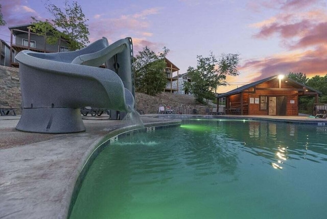 26 Cave Ln Unit 10, Indian Point, MO 65616 - pool at dusk with a water slide