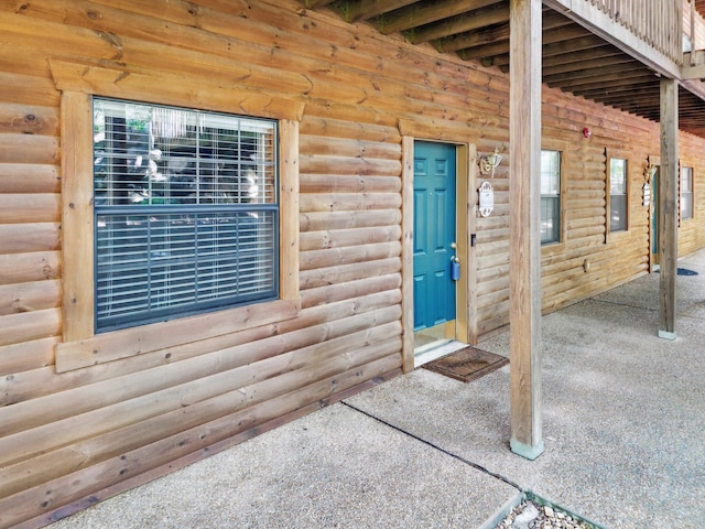 24 Village Trl Unit 13-2, Branson, MO 65616 - doorway to property with faux log siding