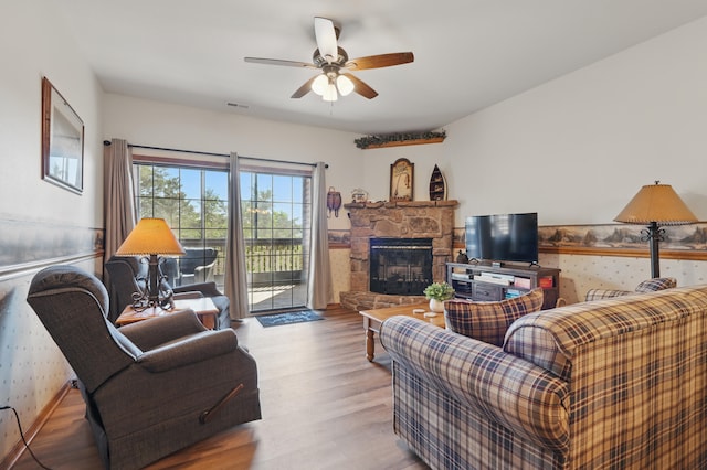 24 Village Trl Unit 13-2, Branson, MO 65616 - living room featuring a fireplace, wood finished floors, and ceiling fan