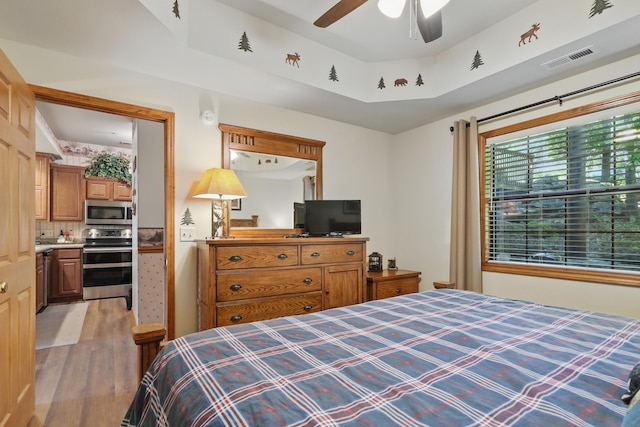 24 Village Trl Unit 13-2, Branson, MO 65616 - bedroom with light wood-type flooring and a ceiling fan