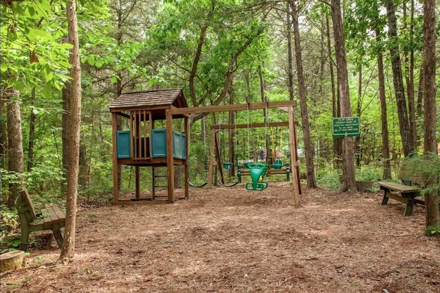 24 Village Trl Unit 13-2, Branson, MO 65616 - community play area featuring a forest view