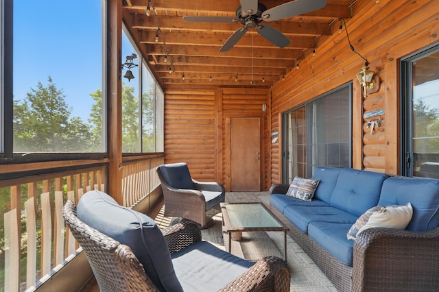 24 Village Trl Unit 13-2, Branson, MO 65616 - sunroom / solarium featuring an outdoor hangout area, plenty of natural light, a ceiling fan, and beam ceiling
