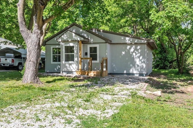741 N Warren Ave, Springfield, MO 65802 - view of front of house with a carport and a front yard