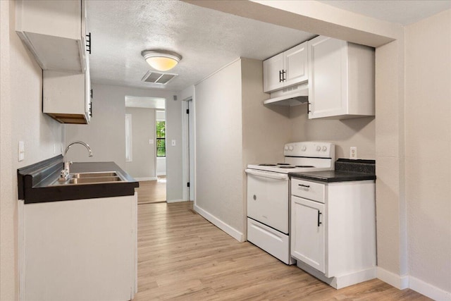 741 N Warren Ave, Springfield, MO 65802 - kitchen with electric range, a sink, light wood-style flooring, dark countertops, and baseboards