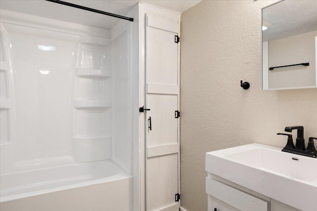 741 N Warren Ave, Springfield, MO 65802 - full bath with a textured wall, a sink, shower / bath combination, and a textured ceiling