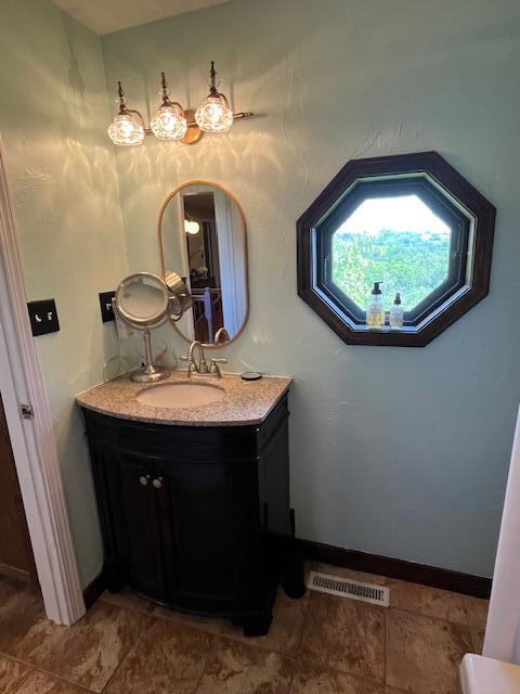 530 Taneycomo Hill Dr, Hollister, MO 65672 - bathroom with vanity and baseboards