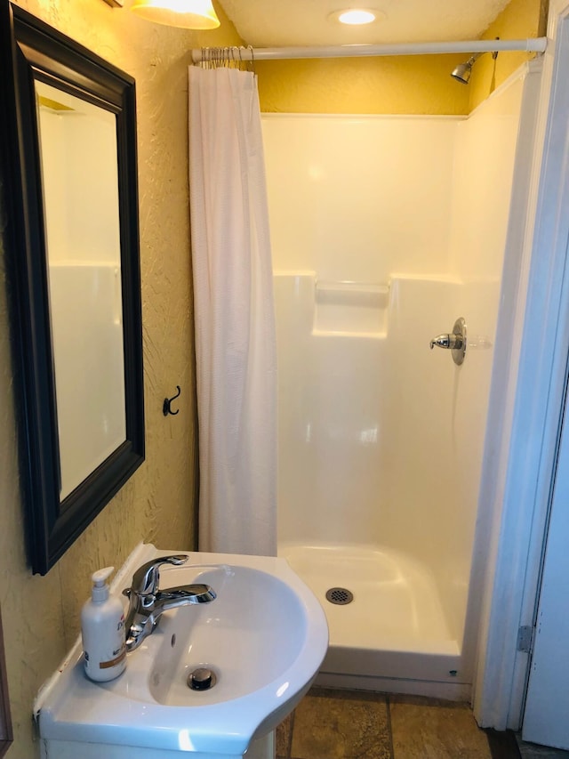 530 Taneycomo Hill Dr, Hollister, MO 65672 - full bathroom featuring a shower stall and a sink