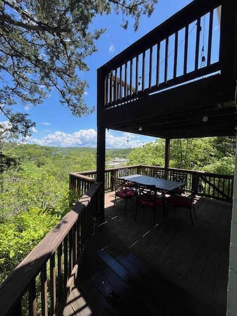 530 Taneycomo Hill Dr, Hollister, MO 65672 - wooden deck with outdoor dining area