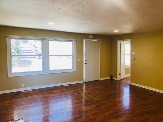 530 Taneycomo Hill Dr, Hollister, MO 65672 - unfurnished living room featuring wood finished floors, baseboards, and recessed lighting