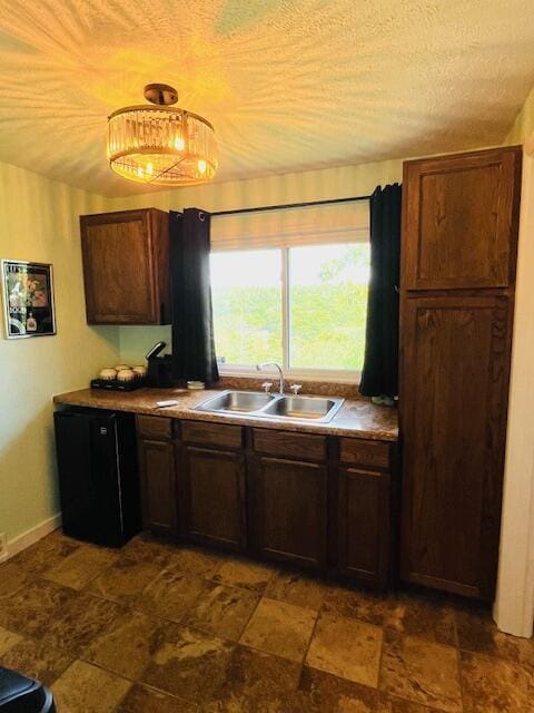530 Taneycomo Hill Dr, Hollister, MO 65672 - kitchen with a sink, dark stone finish floors, and a textured ceiling