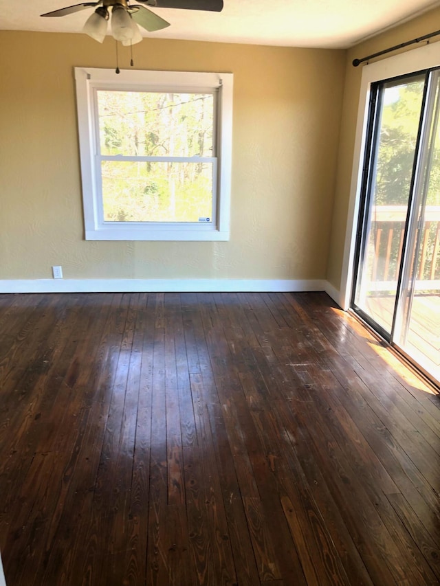 530 Taneycomo Hill Dr, Hollister, MO 65672 - unfurnished room featuring ceiling fan, dark wood-style floors, and baseboards