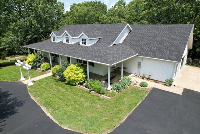 150 Licaria Rd, Ozark, MO 65721 - view of front facade with roof with shingles, a front lawn, driveway, and a porch