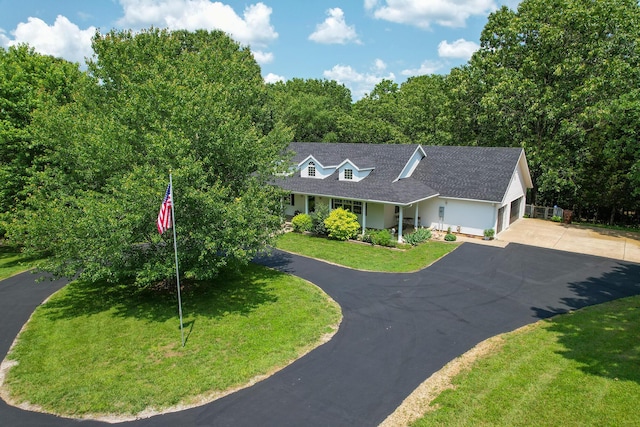 150 Licaria Rd, Ozark, MO 65721 - view of front of house featuring asphalt driveway, a front lawn, a shingled roof, and a garage
