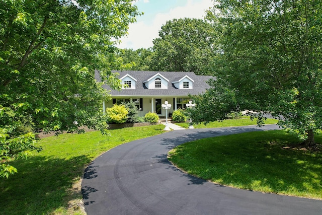 150 Licaria Rd, Ozark, MO 65721 - cape cod-style house with a front yard, a porch, and driveway