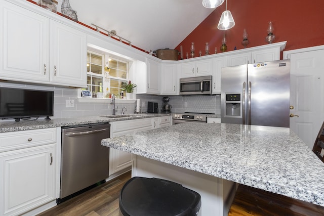 150 Licaria Rd, Ozark, MO 65721 - kitchen featuring appliances with stainless steel finishes, lofted ceiling, tasteful backsplash, and white cabinets