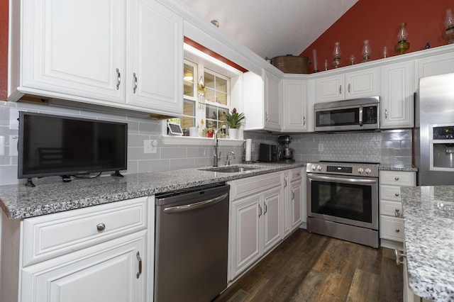 150 Licaria Rd, Ozark, MO 65721 - kitchen featuring stainless steel appliances, vaulted ceiling, backsplash, white cabinets, and dark wood-type flooring