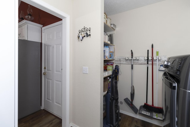 150 Licaria Rd, Ozark, MO 65721 - washroom featuring washer / dryer and dark wood finished floors