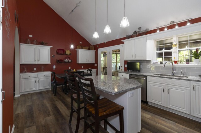 150 Licaria Rd, Ozark, MO 65721 - kitchen featuring track lighting, dishwasher, dark wood finished floors, white cabinets, and high vaulted ceiling