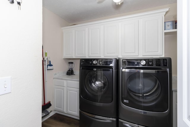 150 Licaria Rd, Ozark, MO 65721 - washroom with washing machine and clothes dryer, cabinet space, and dark wood-type flooring