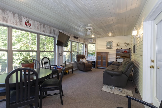 150 Licaria Rd, Ozark, MO 65721 - sunroom / solarium with ceiling fan, french doors, carpet flooring, and wood walls