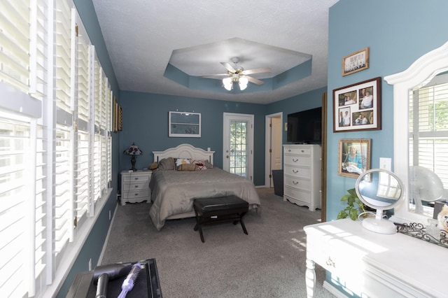 150 Licaria Rd, Ozark, MO 65721 - carpeted bedroom featuring a tray ceiling, a ceiling fan, and a textured ceiling
