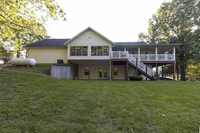 150 Licaria Rd, Ozark, MO 65721 - rear view of house featuring stairway, a yard, a wooden deck, and a sunroom