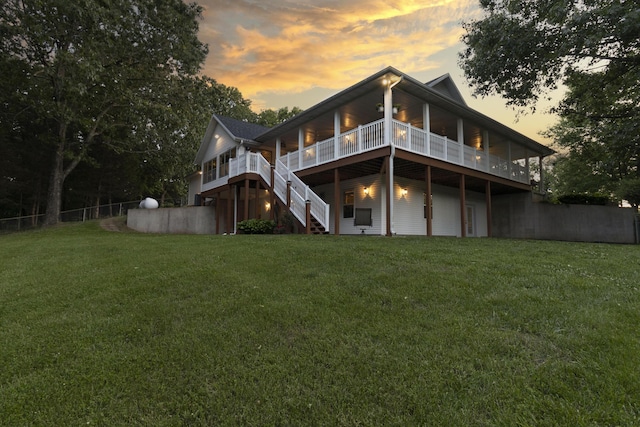 150 Licaria Rd, Ozark, MO 65721 - back of property at dusk with a deck and stairway
