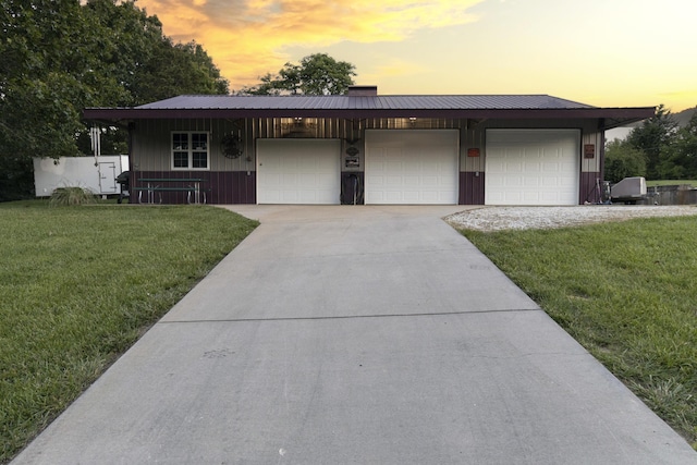 150 Licaria Rd, Ozark, MO 65721 - view of front of house featuring a front yard, a garage, and board and batten siding
