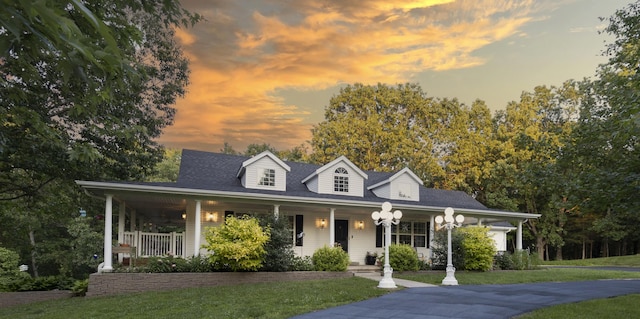 150 Licaria Rd, Ozark, MO 65721 - view of front of property with covered porch and a lawn