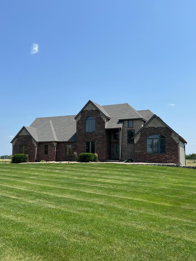 110 Castlekeep Dr, Rogersville, MO 65742 - view of front of house featuring a front lawn, a shingled roof, and brick siding
