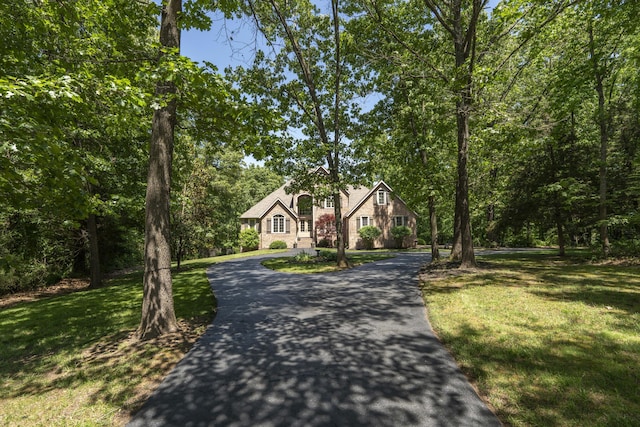 3262 S Thornridge Dr, Springfield, MO 65809 - view of front of home with driveway and a front lawn