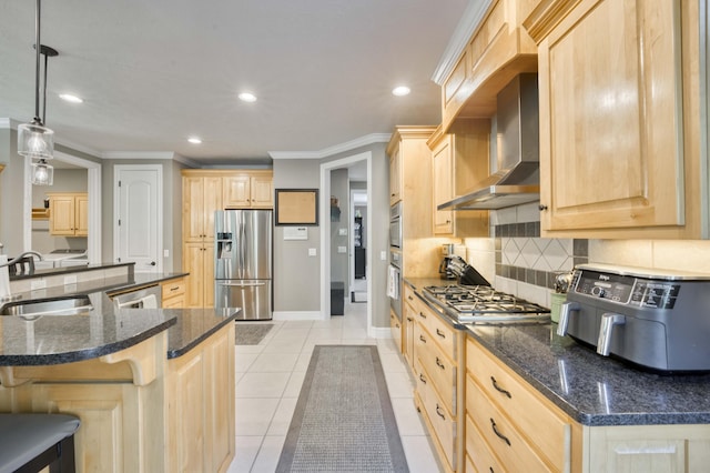 3262 S Thornridge Dr, Springfield, MO 65809 - kitchen with stainless steel appliances, a sink, light brown cabinetry, wall chimney range hood, and recessed lighting