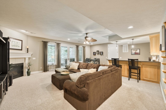 3262 S Thornridge Dr, Springfield, MO 65809 - living area with light colored carpet, a ceiling fan, recessed lighting, baseboards, and a tiled fireplace