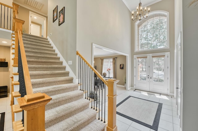 3262 S Thornridge Dr, Springfield, MO 65809 - entrance foyer featuring tile patterned floors, stairs, a towering ceiling, baseboards, and french doors
