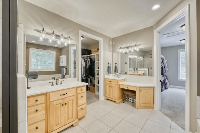 3262 S Thornridge Dr, Springfield, MO 65809 - full bathroom featuring a spacious closet, two vanities, and plenty of natural light