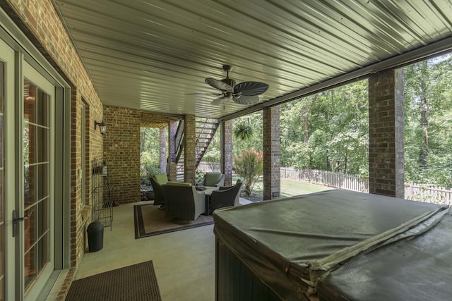 3262 S Thornridge Dr, Springfield, MO 65809 - fenced backyard with a hot tub, a ceiling fan, and a patio area