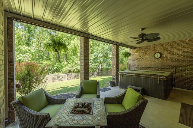 3262 S Thornridge Dr, Springfield, MO 65809 - view of patio / terrace with a hot tub, a ceiling fan, and an outdoor living space with a fire pit