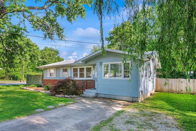 332 E Silsby St, Springfield, MO 65807 - view of front facade featuring brick siding and driveway
