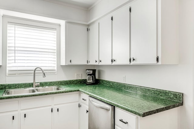 332 E Silsby St, Springfield, MO 65807 - kitchen with stainless steel dishwasher, a sink, dark countertops, and white cabinets