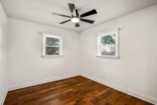 332 E Silsby St, Springfield, MO 65807 - empty room featuring baseboards, dark wood finished floors, and ceiling fan