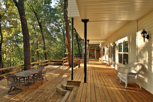 607 Sumac Ln, Marshfield, MO 65706 - deck with outdoor dining area and stairs
